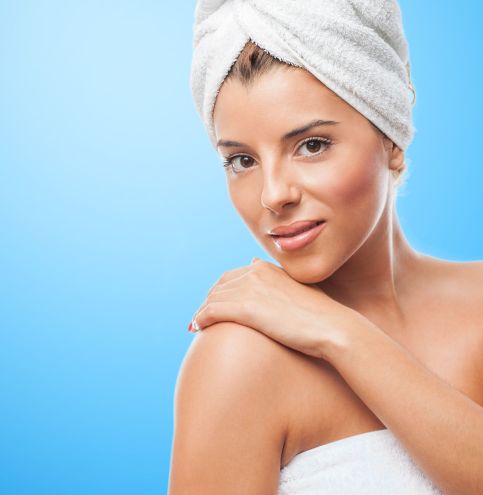 portrait of a beautiful young woman taking a bath